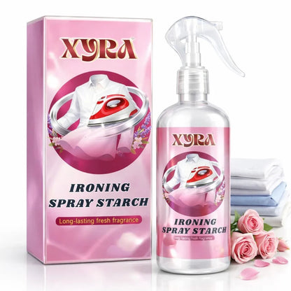 Ironing spray starch bottle and box with fresh roses, folded shirts, and long-lasting fragrance label.