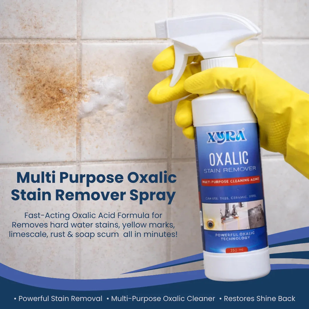 Hand in yellow glove using oxalic acid stain remover spray to clean stained bathroom tiles.