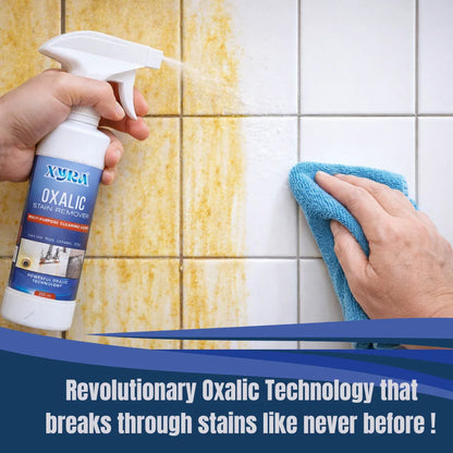 Multipurpose stain remover spray being used to clean yellow stains from tiled wall with microfiber cloth.