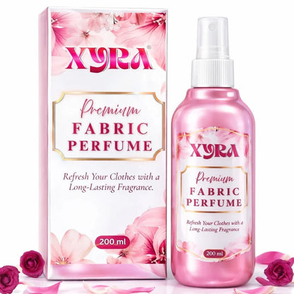 Pink fabric perfume spray bottle and box with floral design, labeled 200ml, surrounded by rose petals.