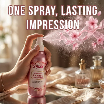 Hand spraying fabric perfume for clothes with floral mist effect, elegant bedroom setting